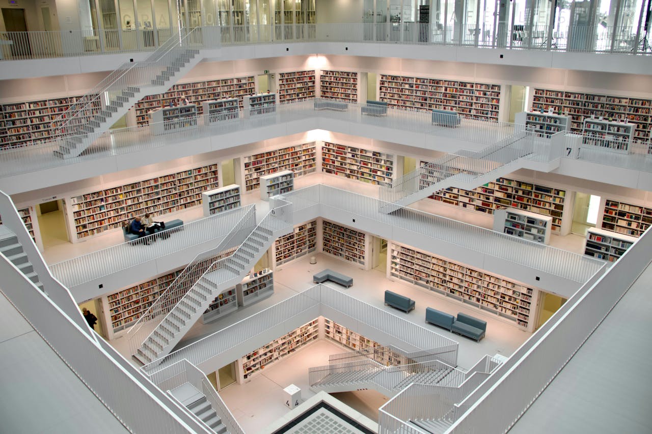 Spacious multi-story library interior in Stuttgart showcasing modern architecture and design.